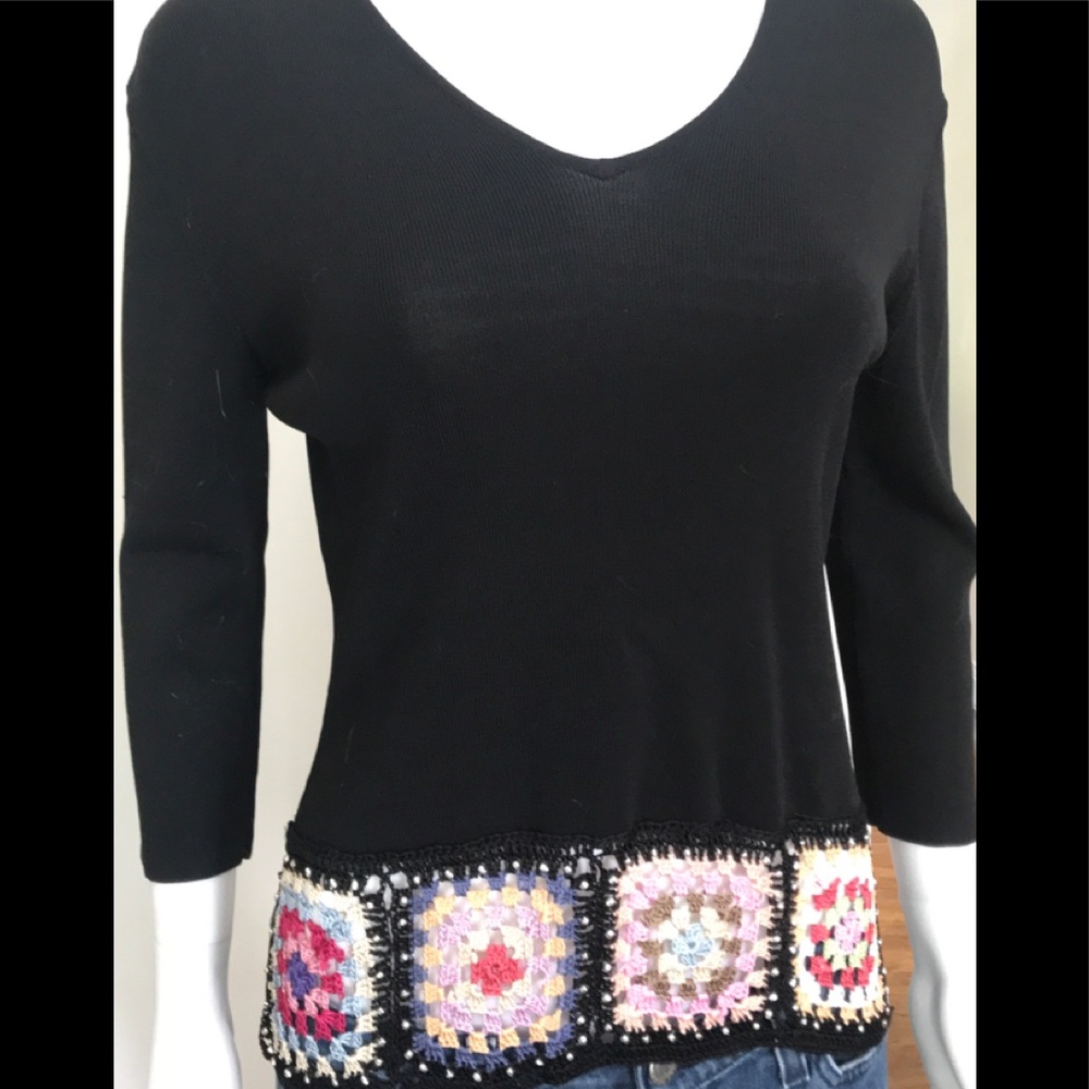 Black top with crochet embellishments